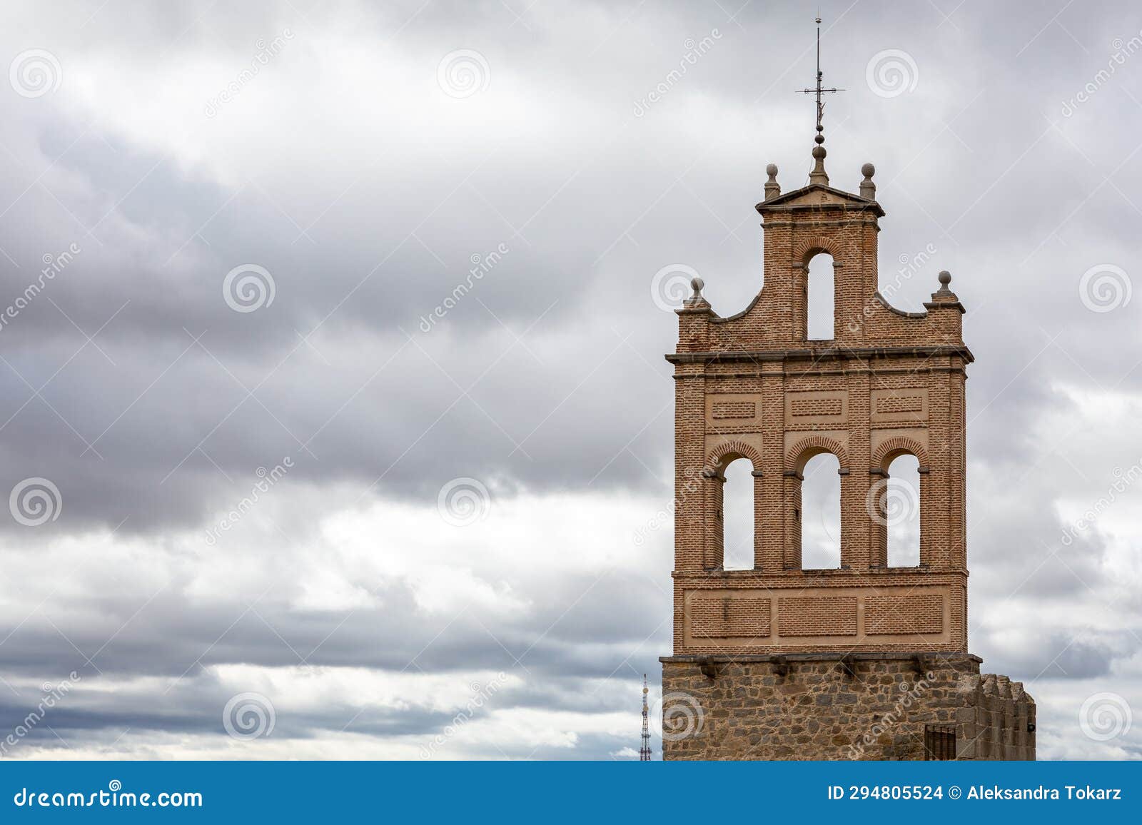 bell-gable bell tower (wall bell tower) in puerta del carmen gate to wall of avila, spain.