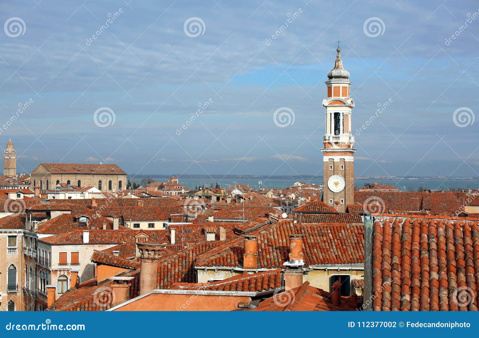 bell tower of church of the holy apostles of christ and many house in the cannaregio sestiere of venice in italy