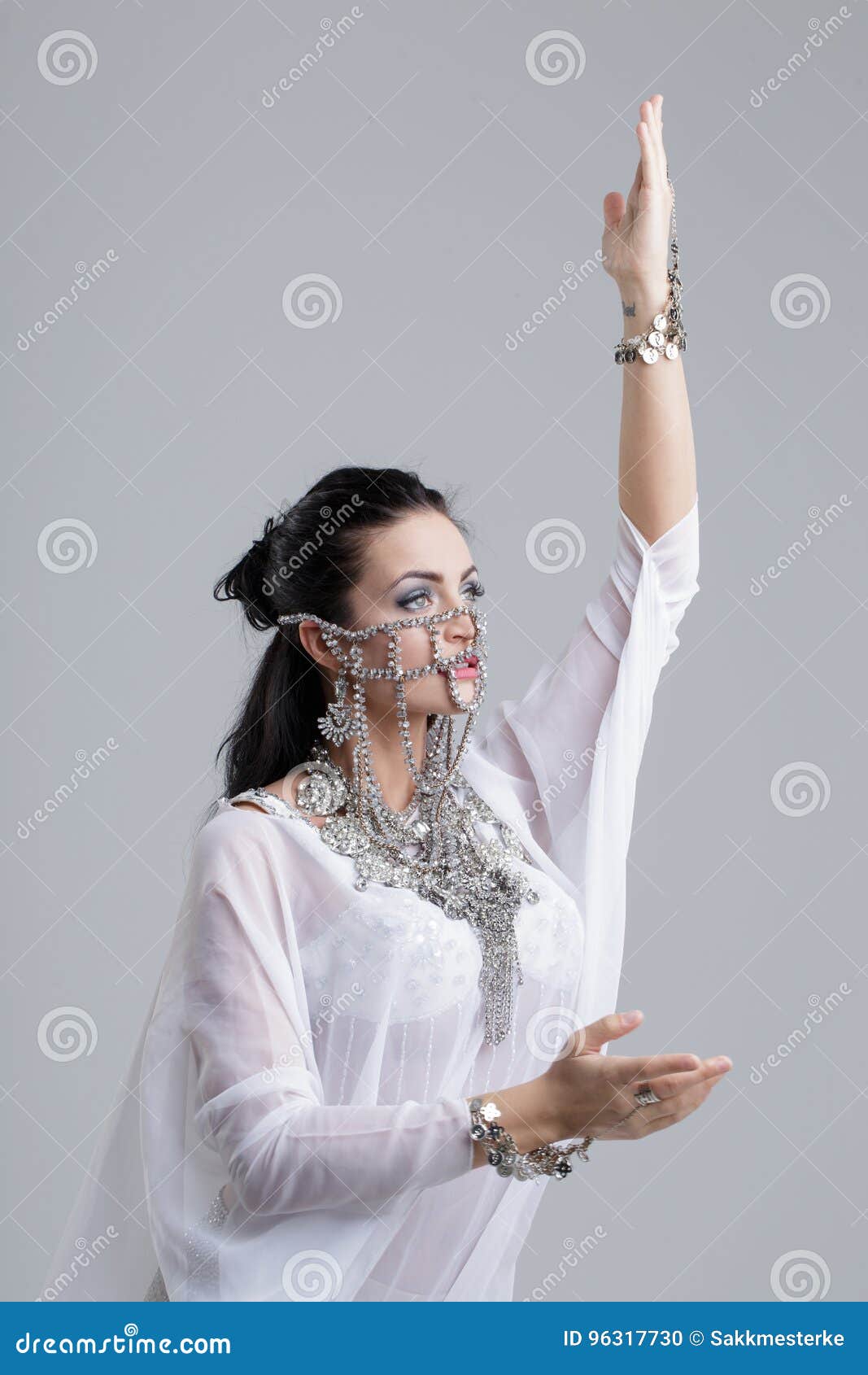 belly dancer woman bellydancing on grey background