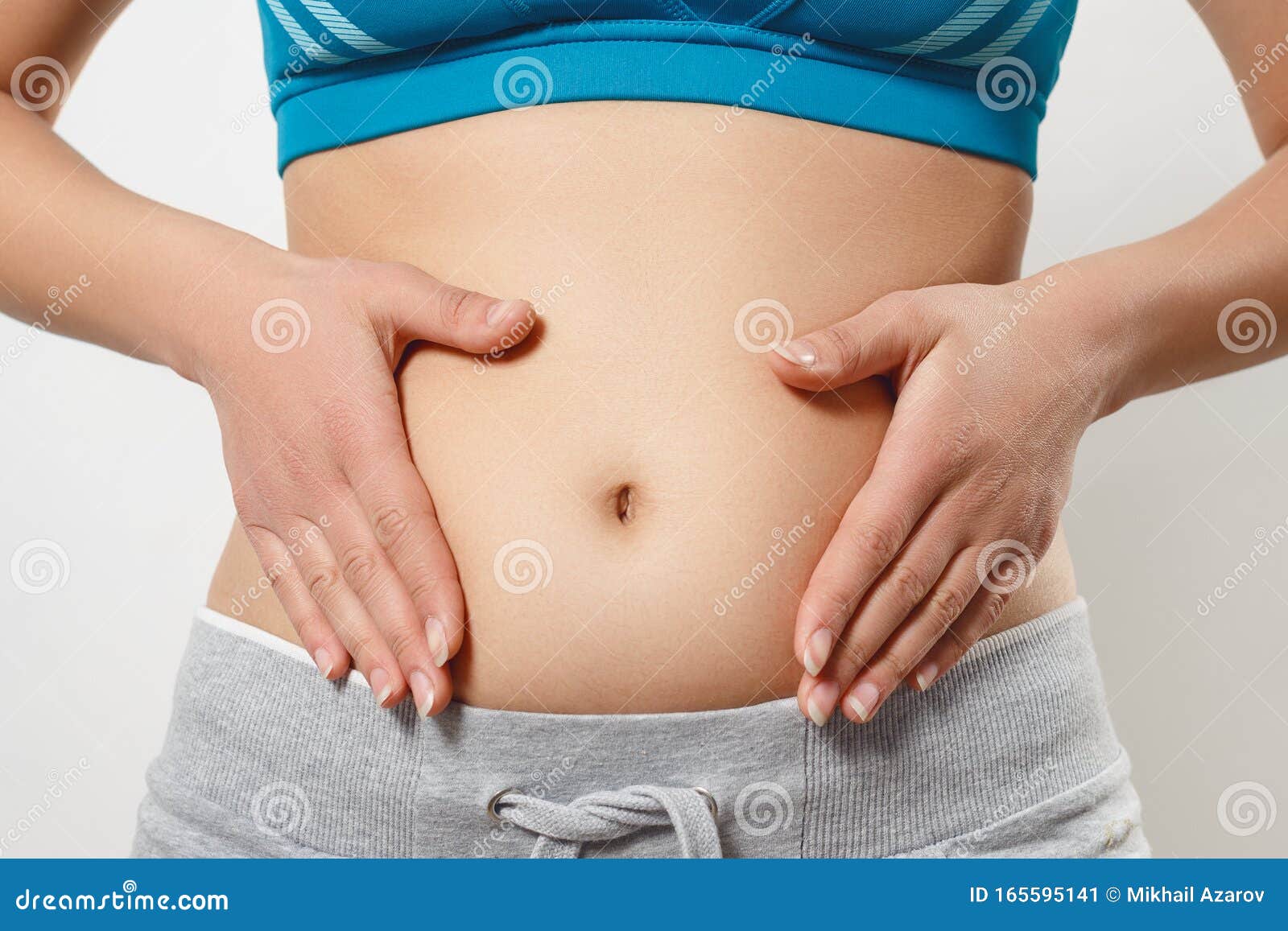 Belly Of A Young Woman In The Early Stages Of Pregnancy ...