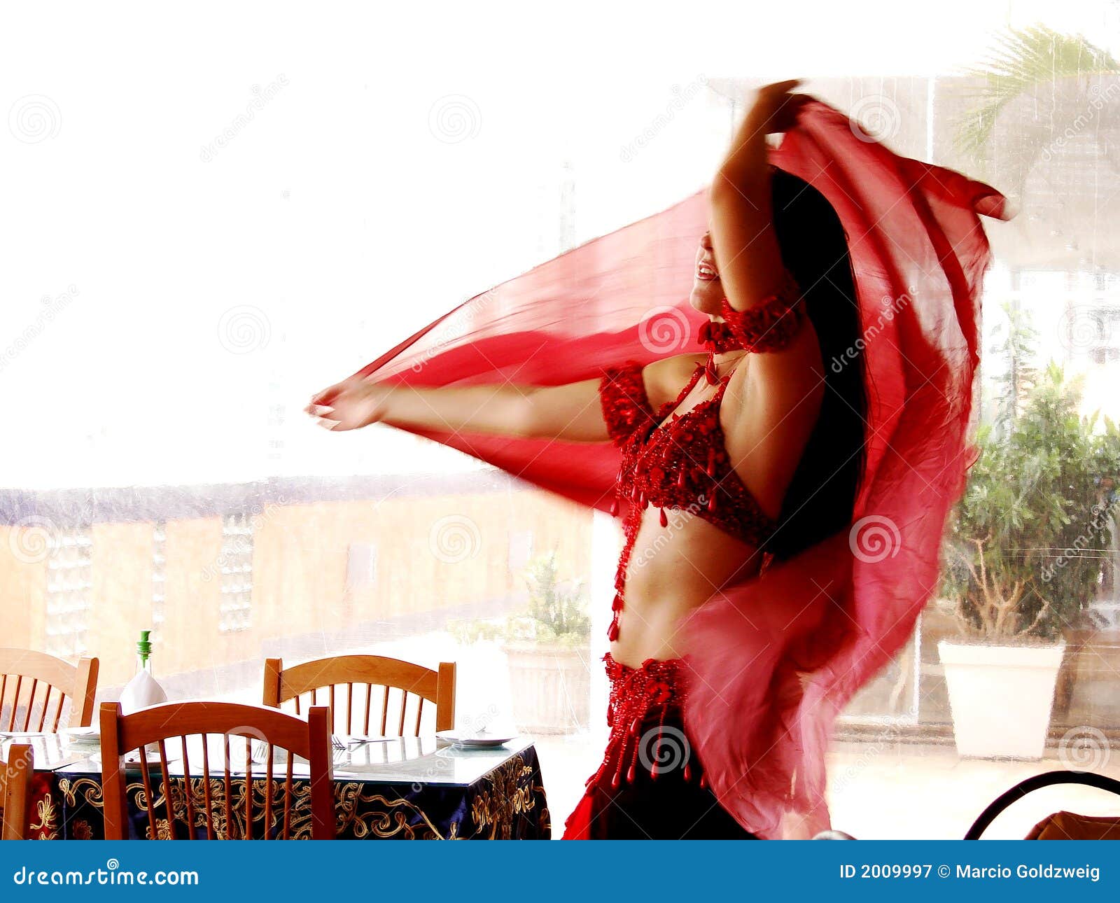 Bellydancer. Egyptian belly dancer with red clothes