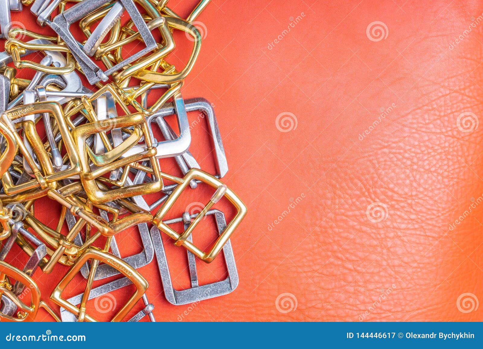 Belt Buckles and Coral Leather Background with Empty Space for Mockup
