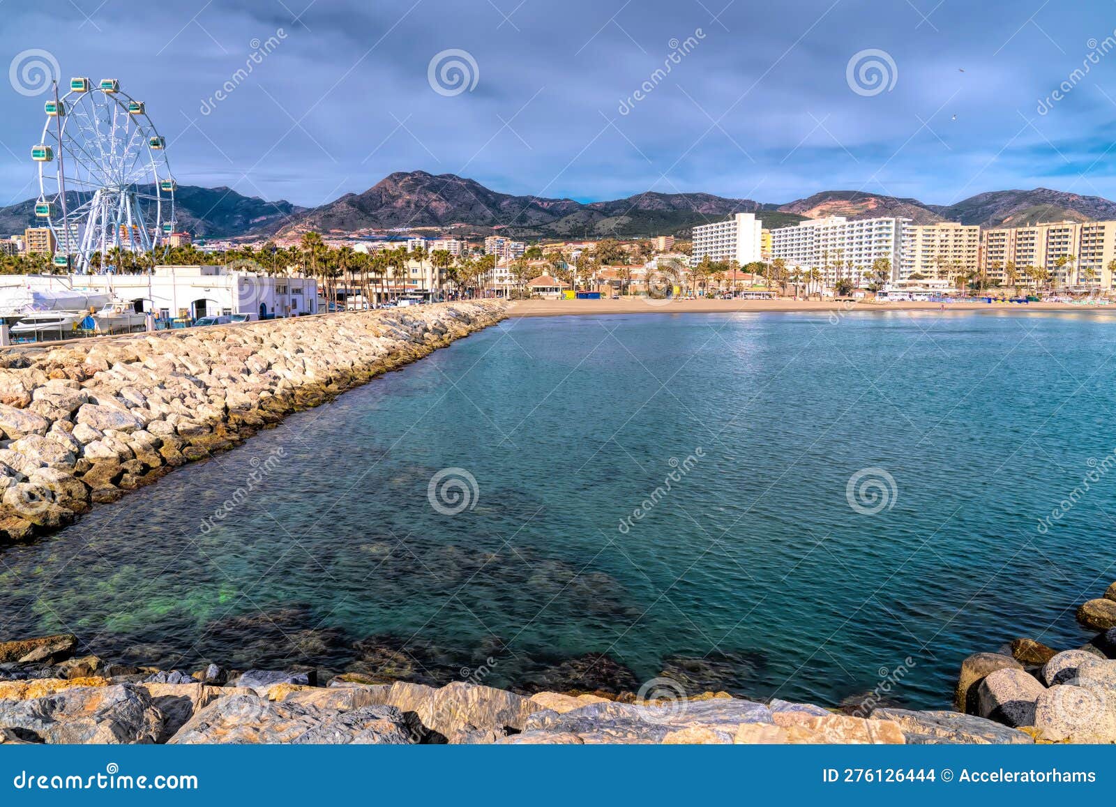 benalmadena beach playa de fuente salud with big wheel and view to mountains spain