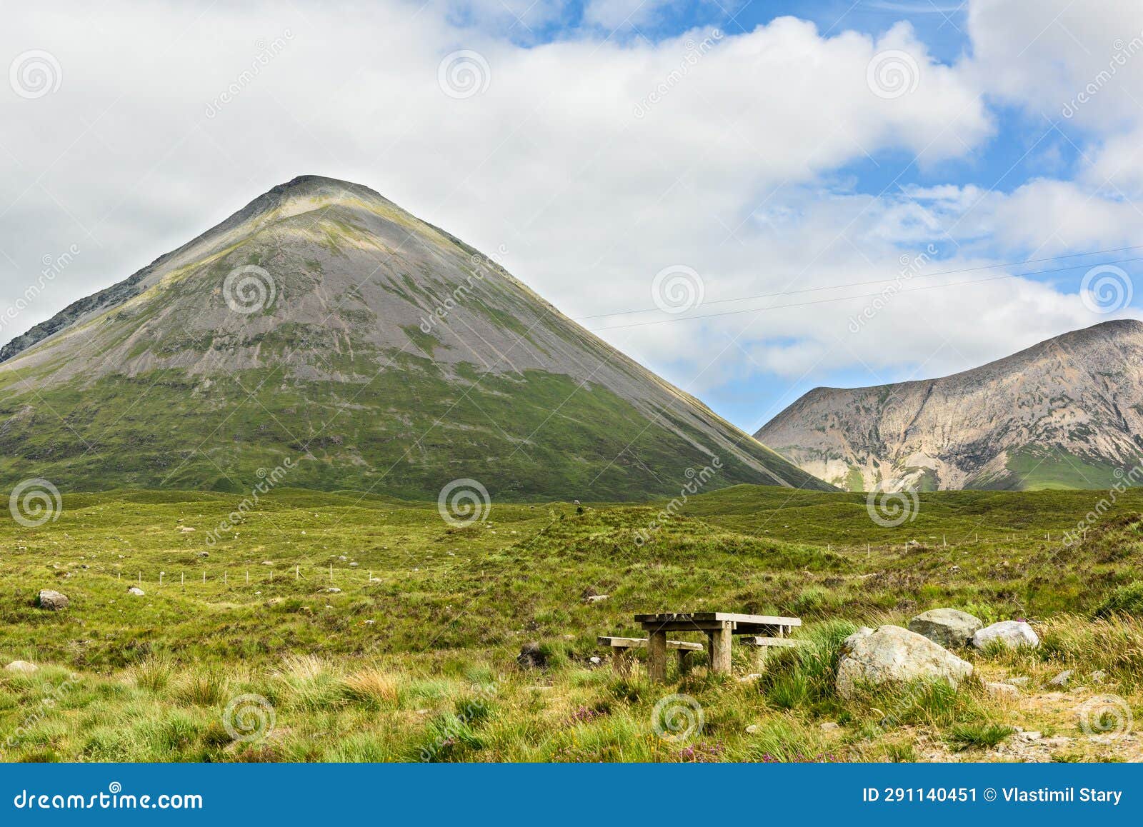 bench at the northeastern foot of the cuillin mountains, isle of skye, scotland, uk