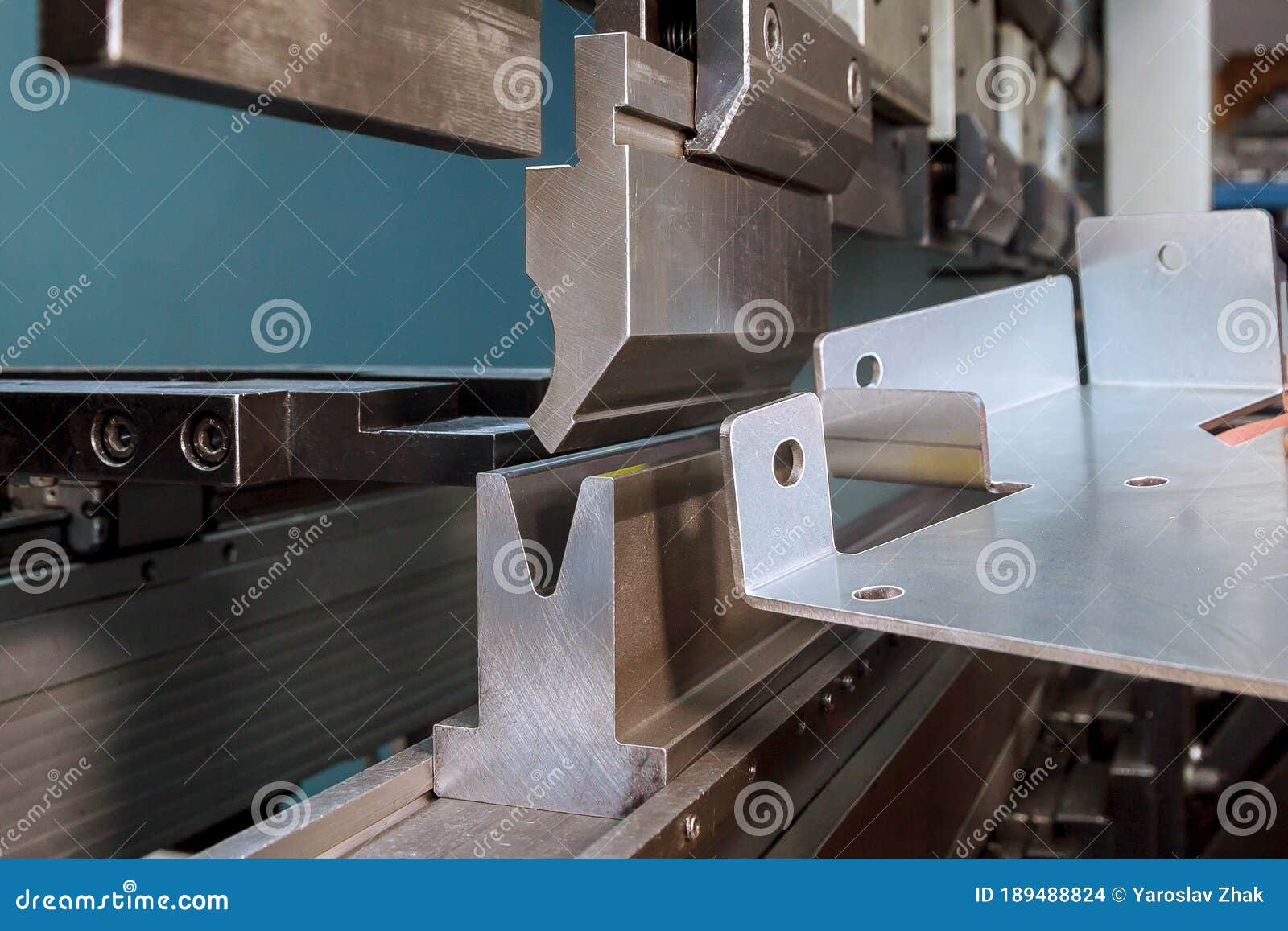 Bending Sheet Metal with a Hydraulic Machine at the Factory Stock Photo