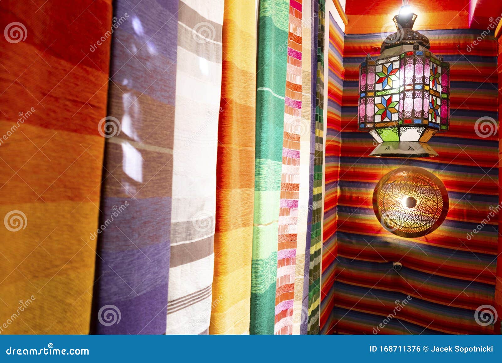 colorful arabic carpets and lamp in marrakech, morroco