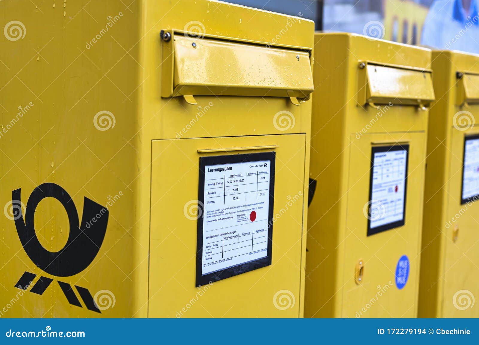 Several Mailboxes of the German Post on a Sidewalk. Editorial Stock