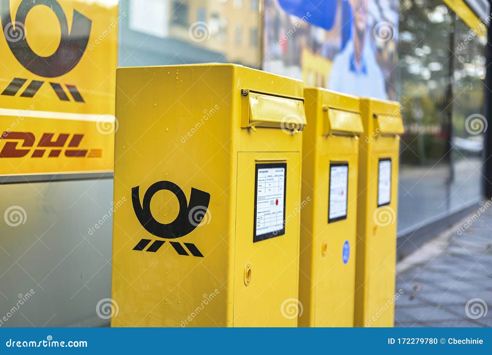 Several Mailboxes of the German Post on a Sidewalk. Editorial Image