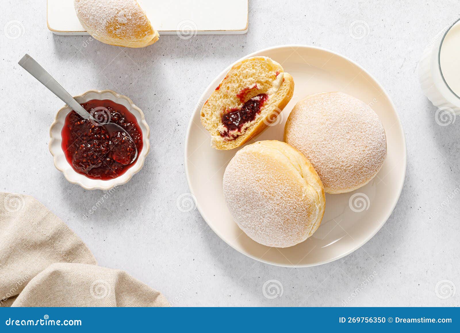 Berliner Donut. Traditional German Donut with Raspberry Jam, Dusted with Icing Sugar Stock Photo