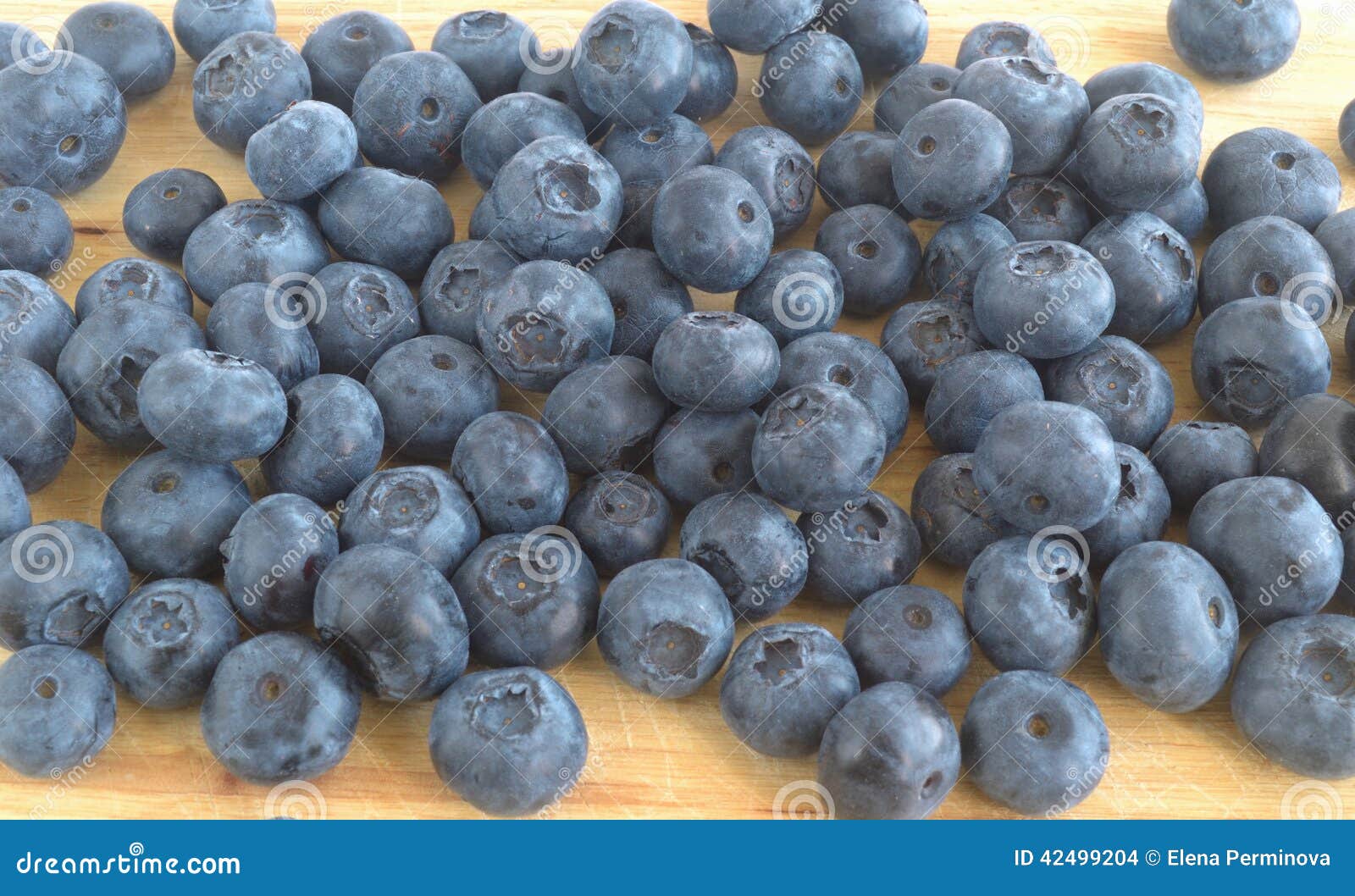 The Berries of Blueberry Scattered on a Cutting Board Stock Photo