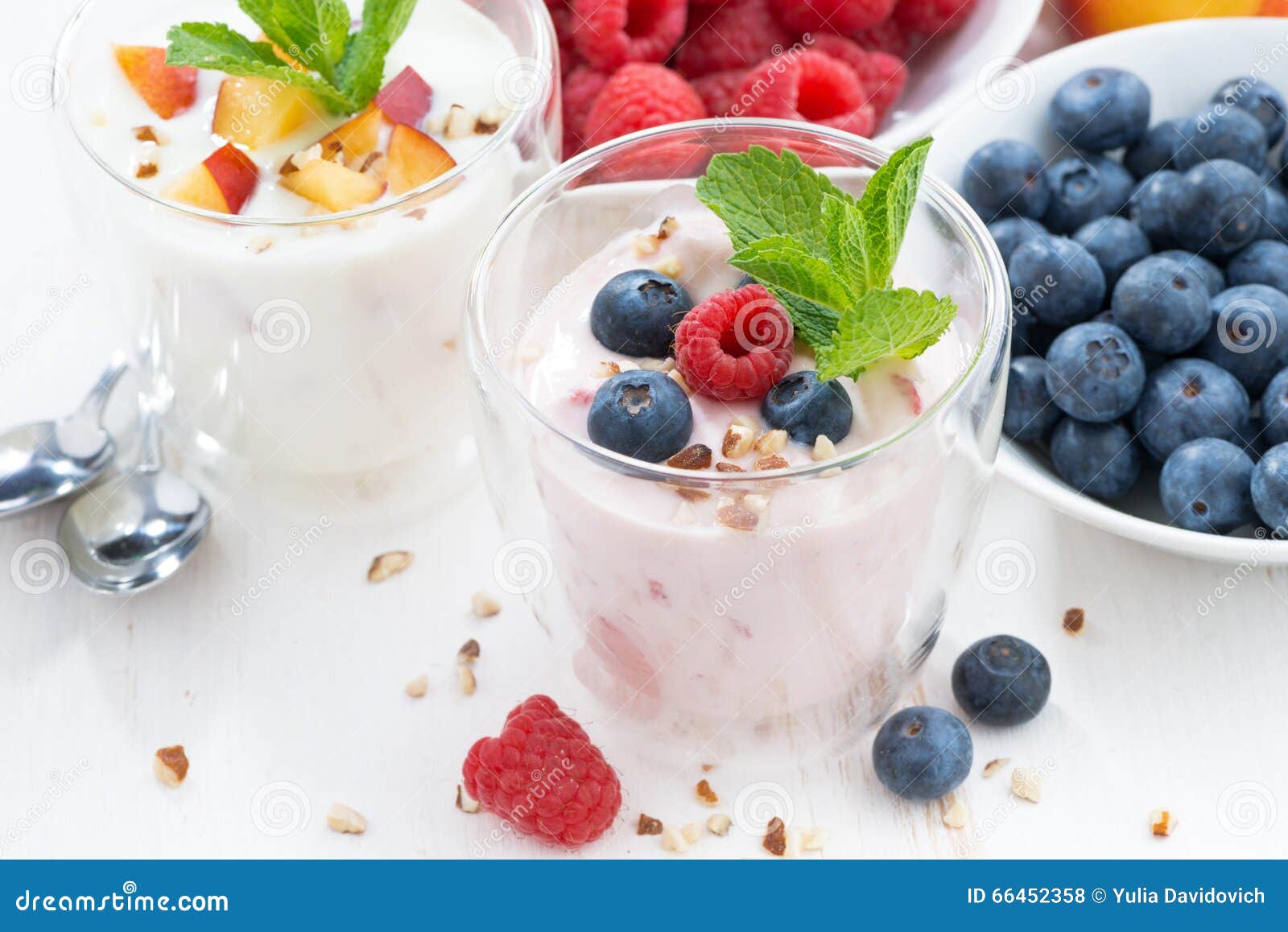 Berry and Fruit Yoghurt and Fresh Ingredients on White Table Stock