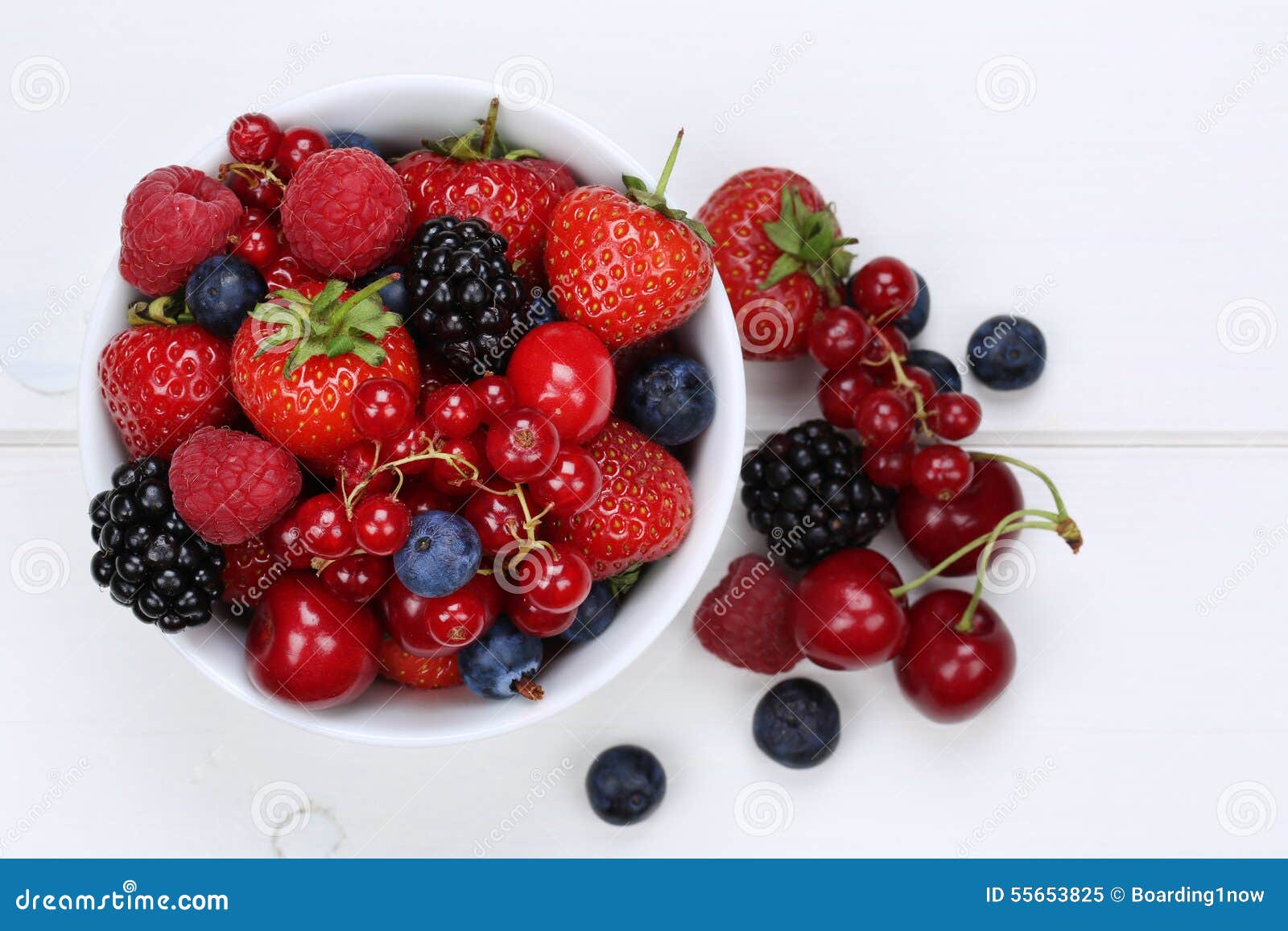 berry fruits mix in bowl with strawberries, blueberries and cherries from above