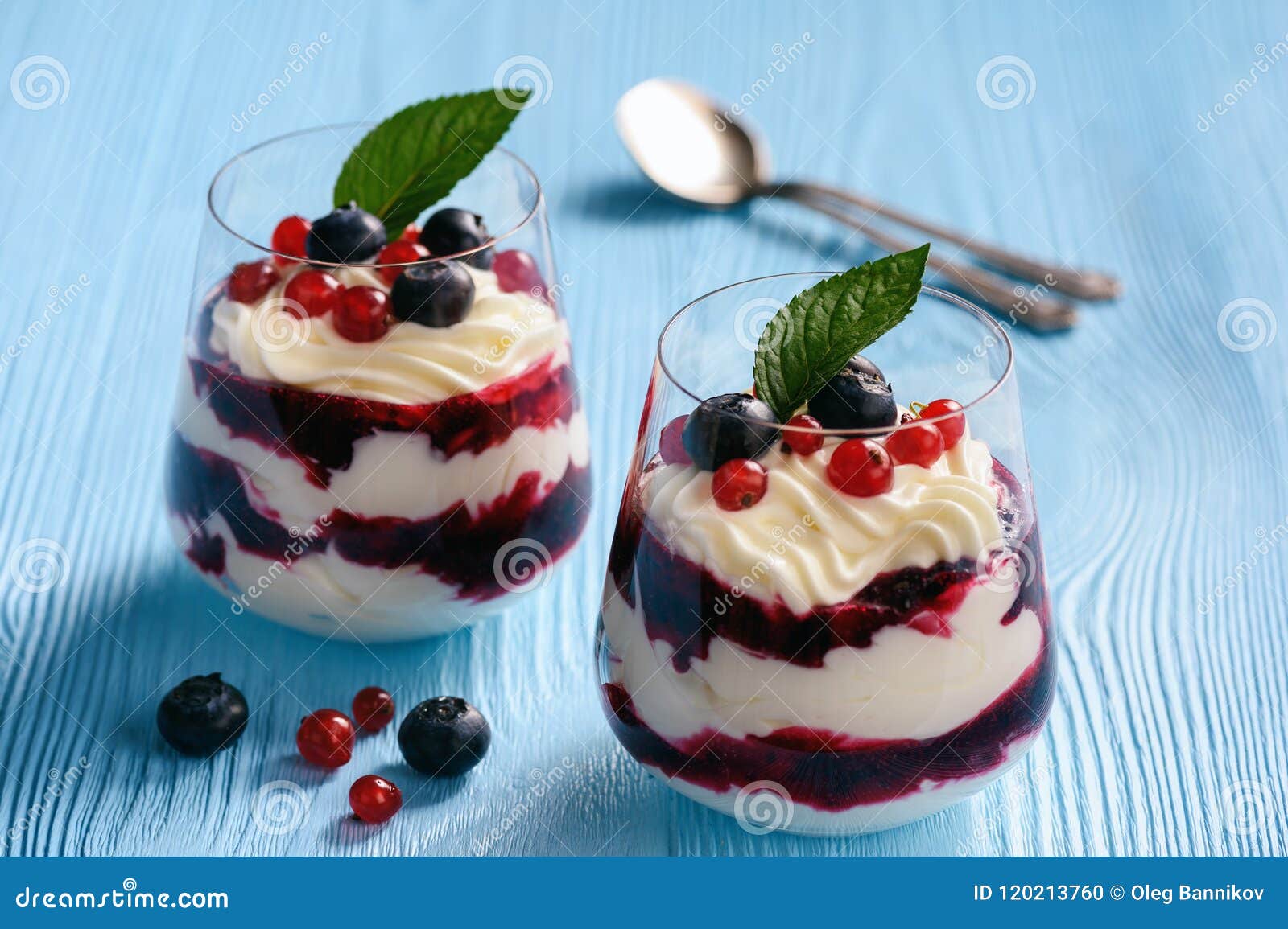Berry Mascarpone Mousse Dessert, on Blue Background. Stock Photo