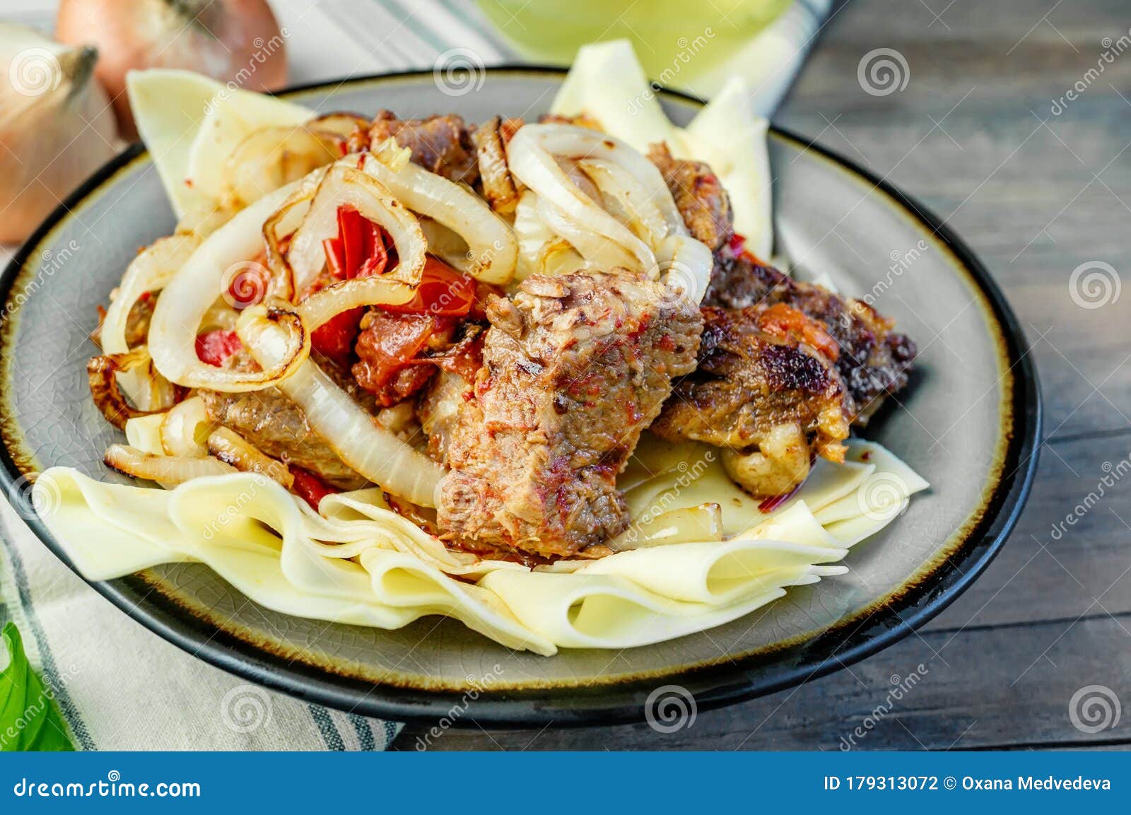 Beshbarmak Dish: Noodles with Lamb and Onion Close-up on a Plate on the ...