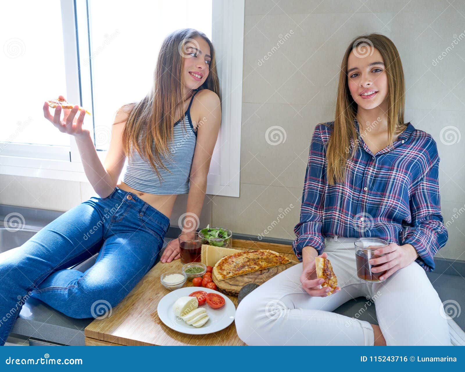 Best Friend Girls Eating Pizza in the Kitchen Stock Photo - Image of ...