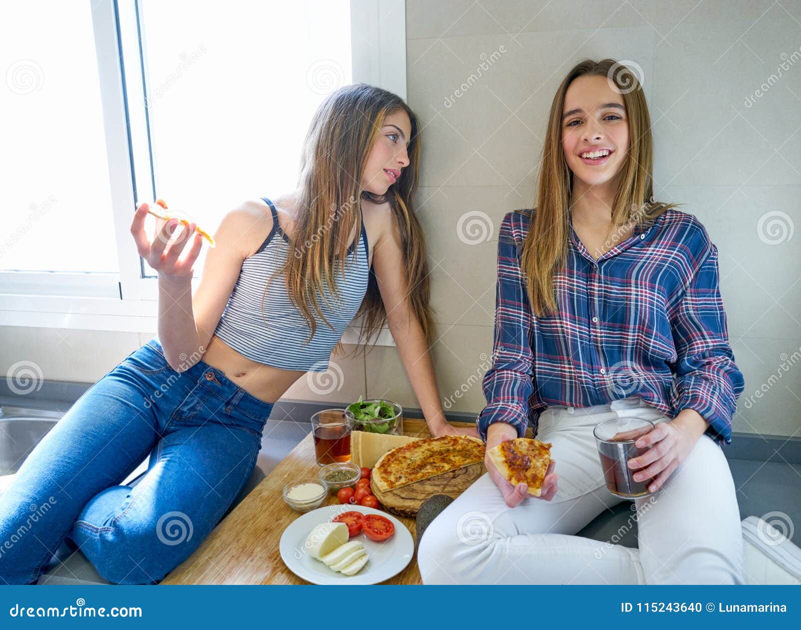 Best Friend Girls Eating Pizza in the Kitchen Stock Photo - Image of ...