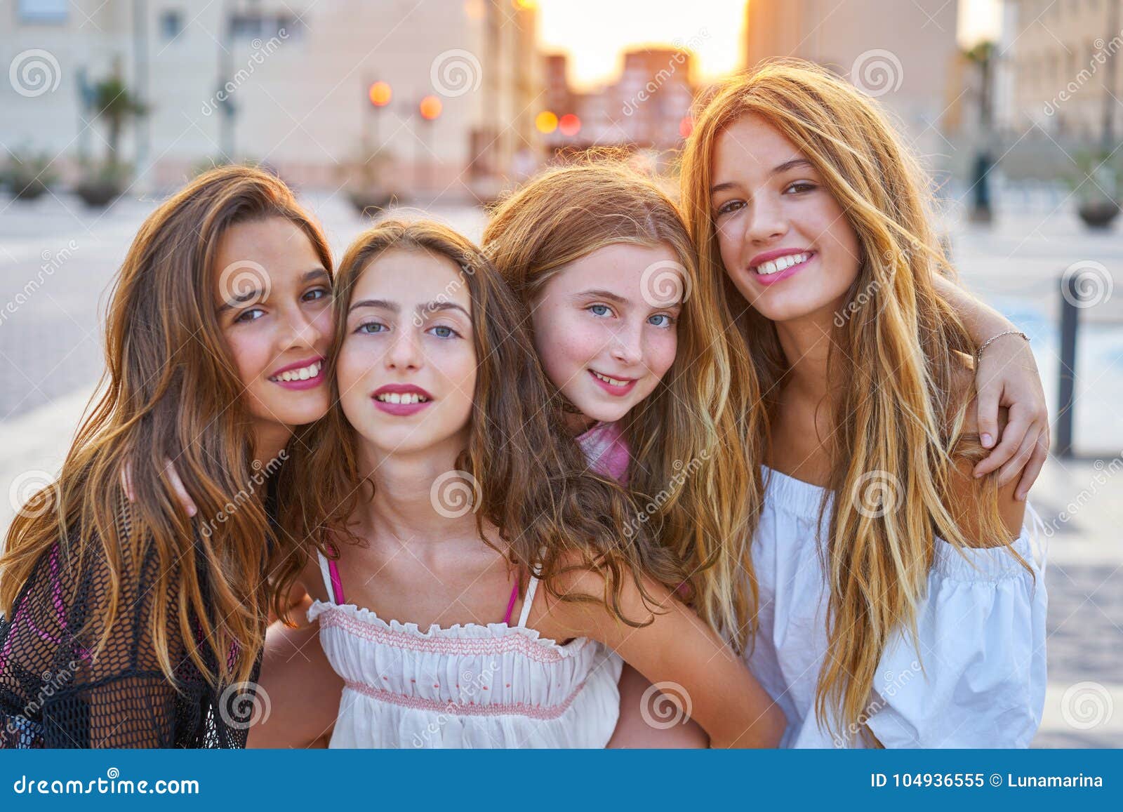 best friends teen girls at sunset in the city