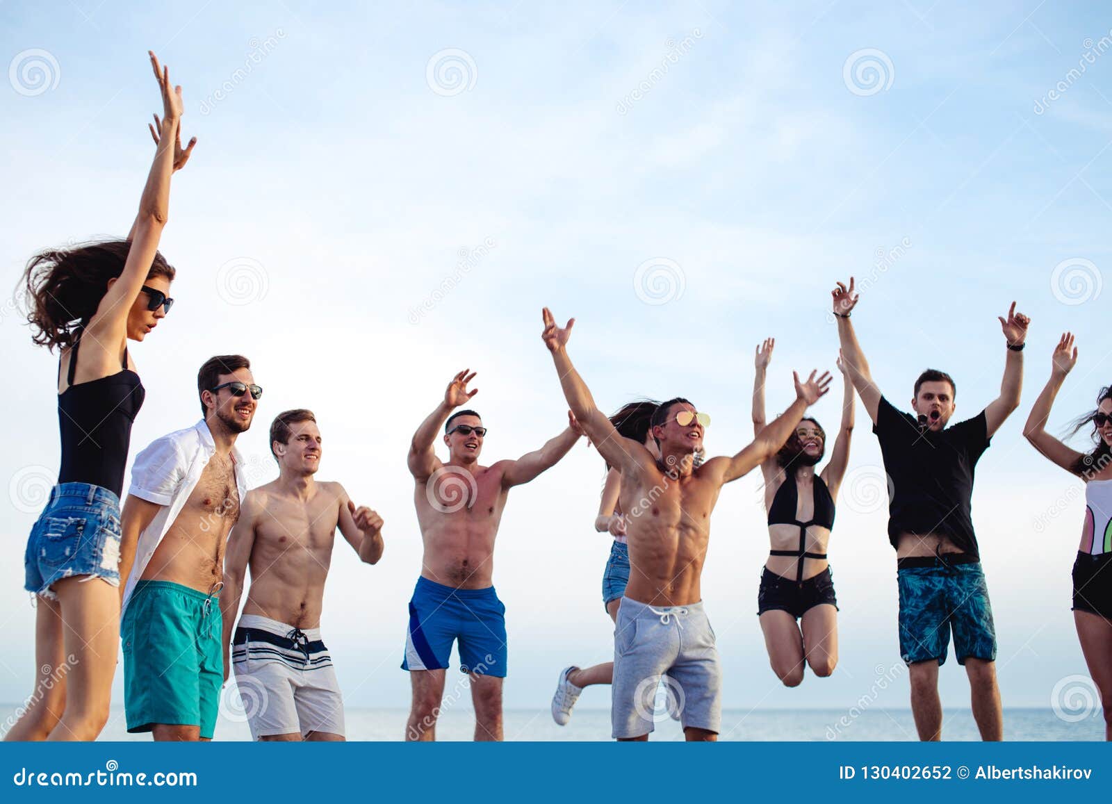 Friends Dance on Beach Under Sunset Sunlight, Having Fun, Happy, Enjoy ...