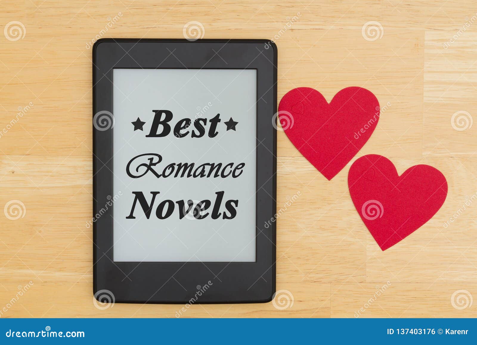 best romance novels text on an e-reader on a wood desk with two hearts