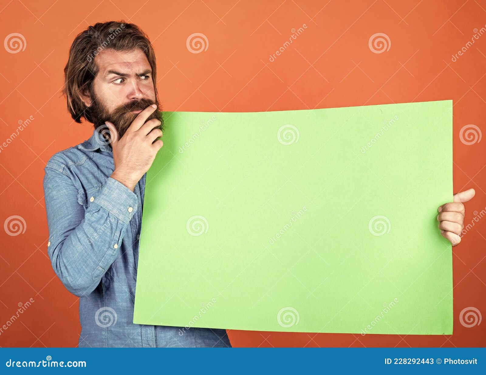 a better decision. empty place for copy space. need help. bearded man holding placate. wanted. empty paper for your