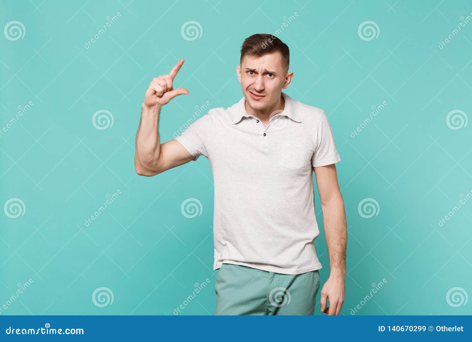 Bewildered Young Man in Casual Clothes Gesturing Demonstrating Size ...