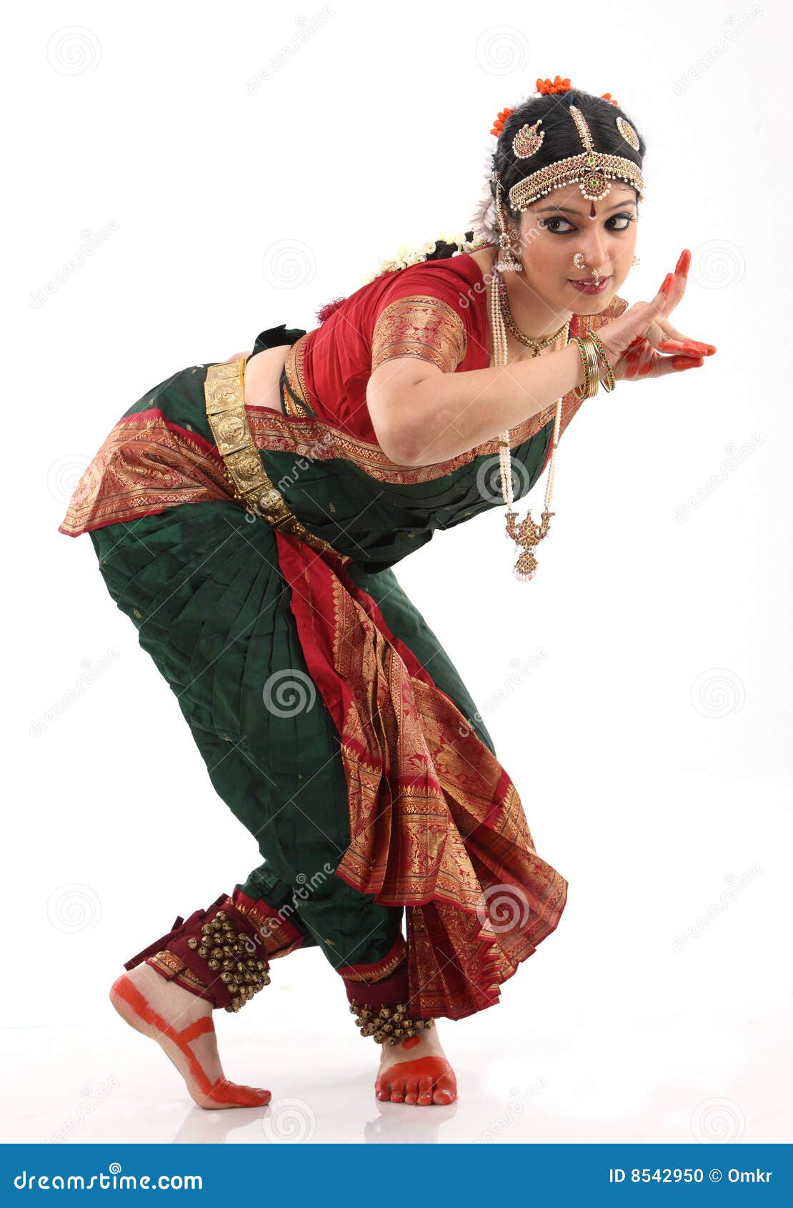 Portrait of white girl as an Indian classical dancer in traditional dress  and performing dance performance on the red curtain background. Classical  indian temple dance form Bharatanatyam. Dance pose Stock Photo |