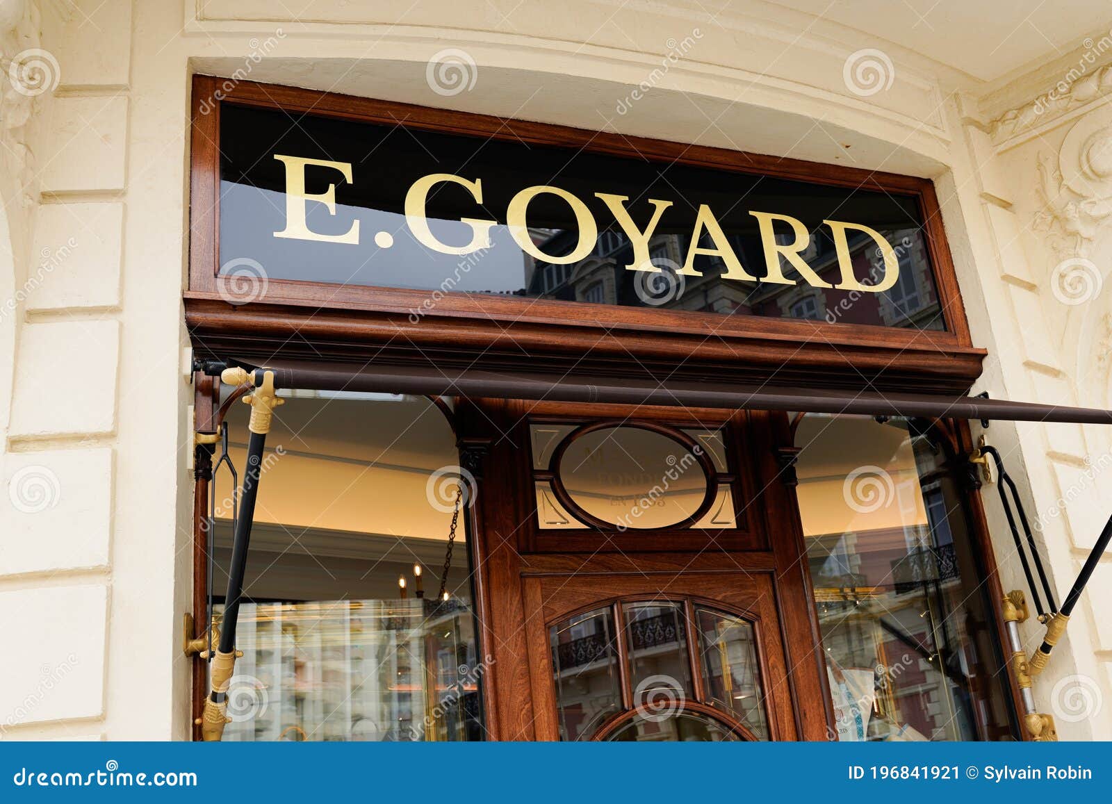 Goyard Logo and Golden Text Sign on Wall of Luxury E.Goyard Store