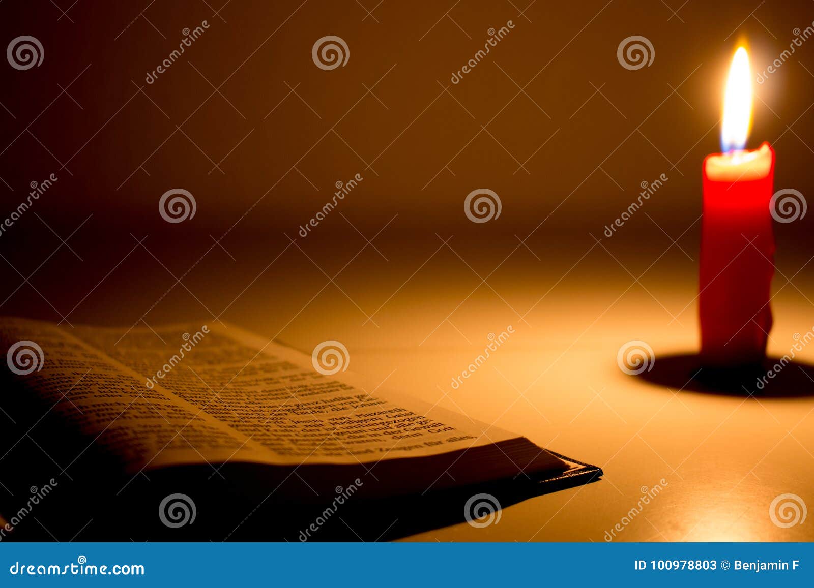 The bible with candle stock image. Image of burning 100978803