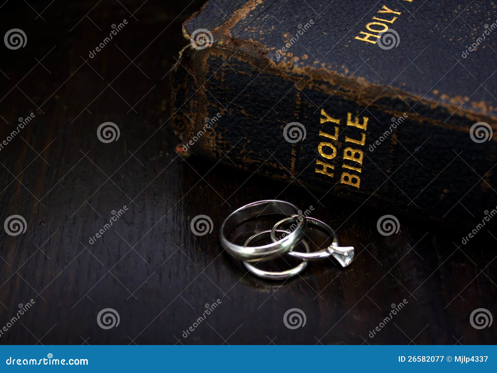 Bible with Wedding Rings stock image. Image of verse 26582077