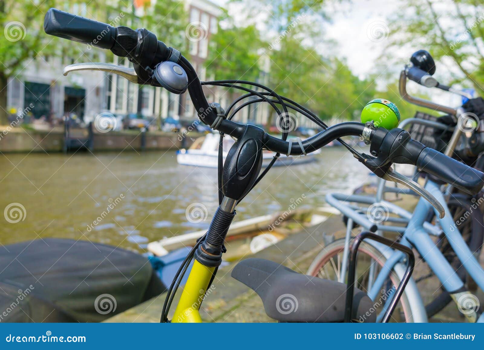 Bicycle closeup by canal stock photo. Image of bokeh - 103106602