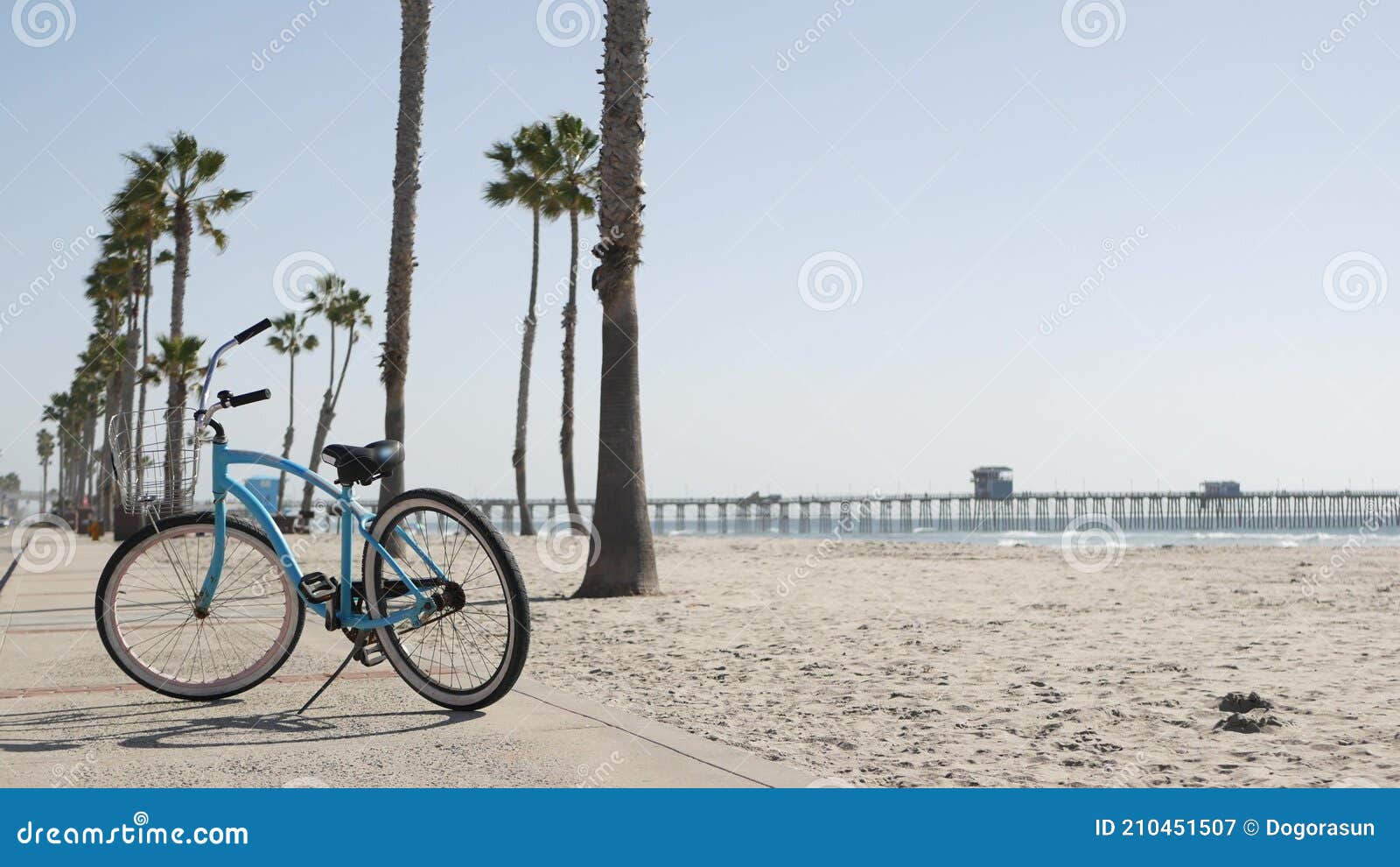 bicycle cruiser bike by ocean beach, california coast usa. summer cycle, lifeguard hut and palm tree