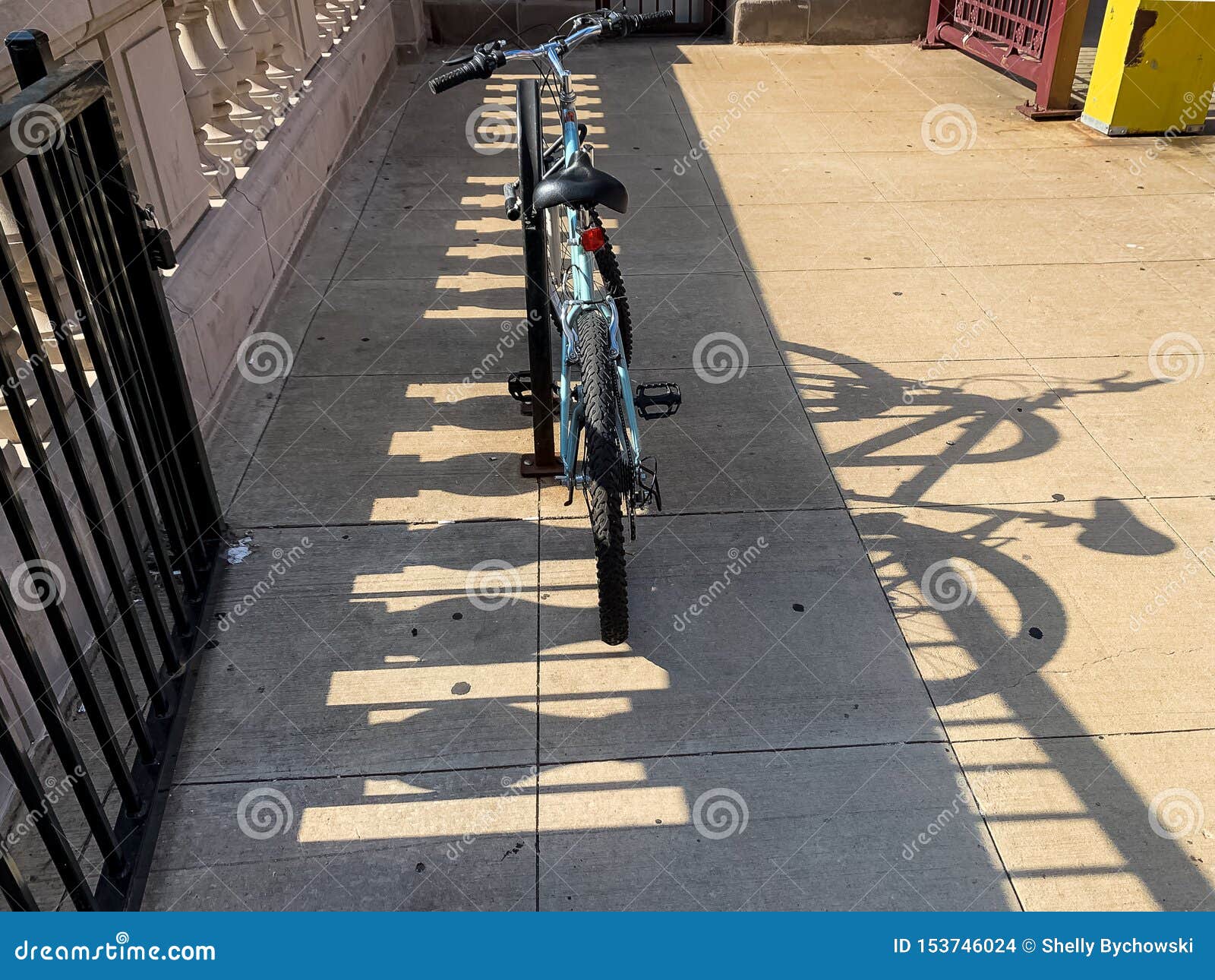 bicycle and its shadow on lasalle bridge in chicago loop during evening commute