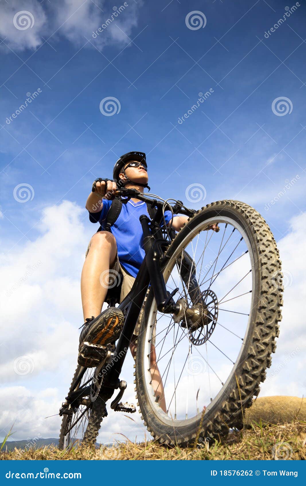 Bicycle rider on the hill stock photo. Image of asian 18576262