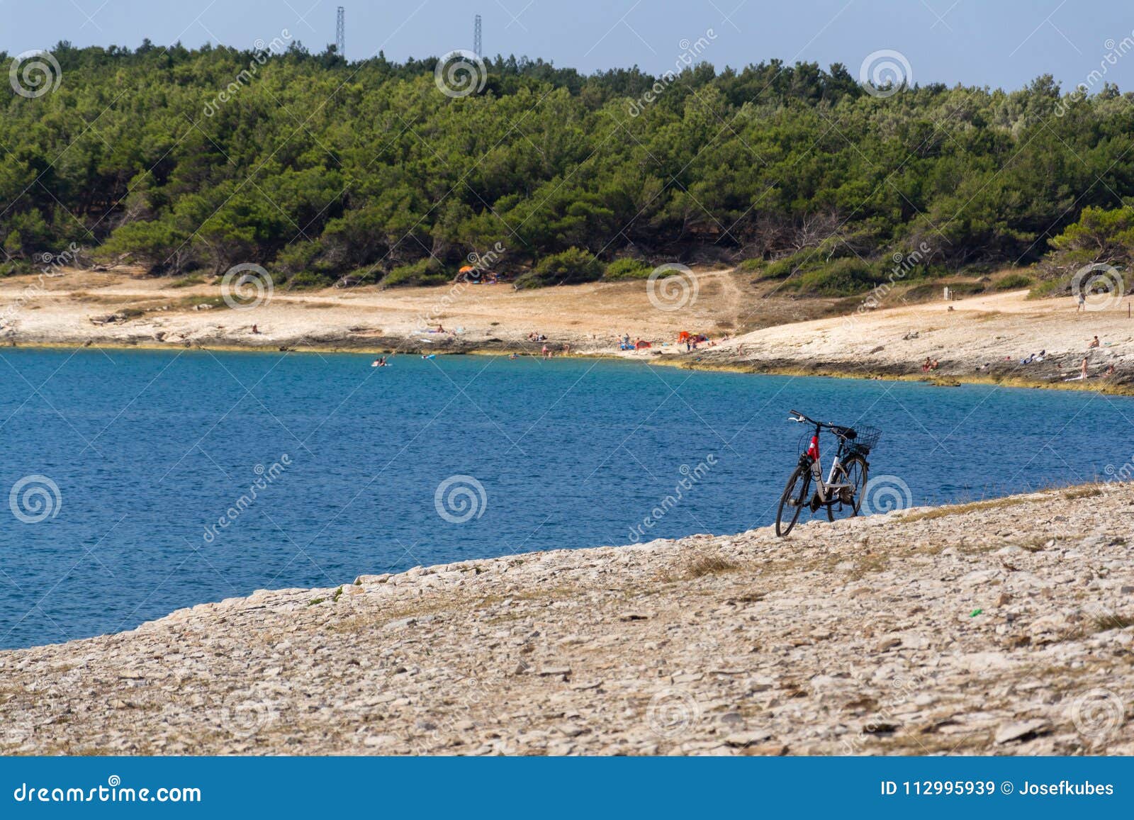 bicycle on stony beach, kamenjak peninsula, adriatic sea, premantura, croatia