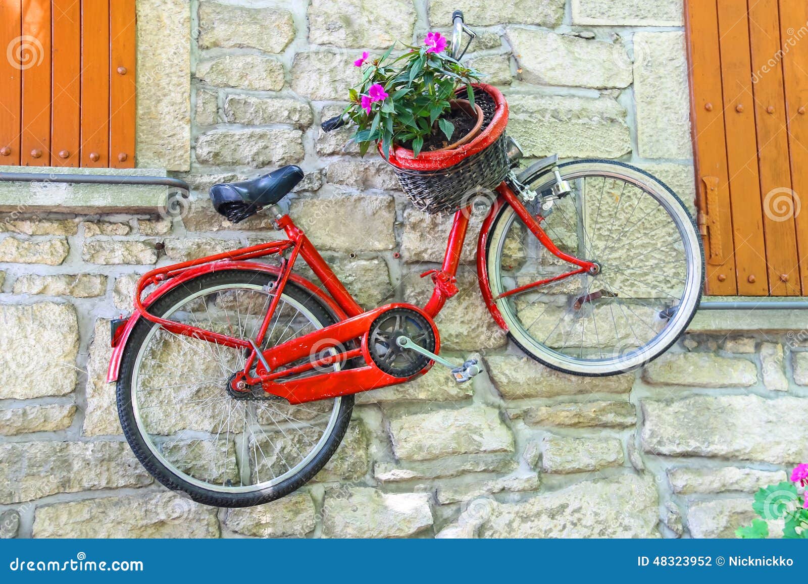 Bicycle on a Wall with Flowers in a Basket Stock Photo Image of bloom