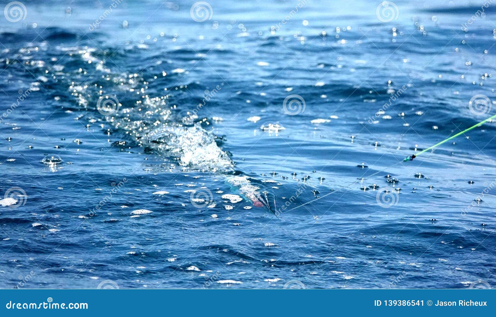 Big Bubble Trail from a Trolling Lure, Sportfishing Dragging a Lure, Making  Bubbles. Stock Image - Image of blue, making: 139386541