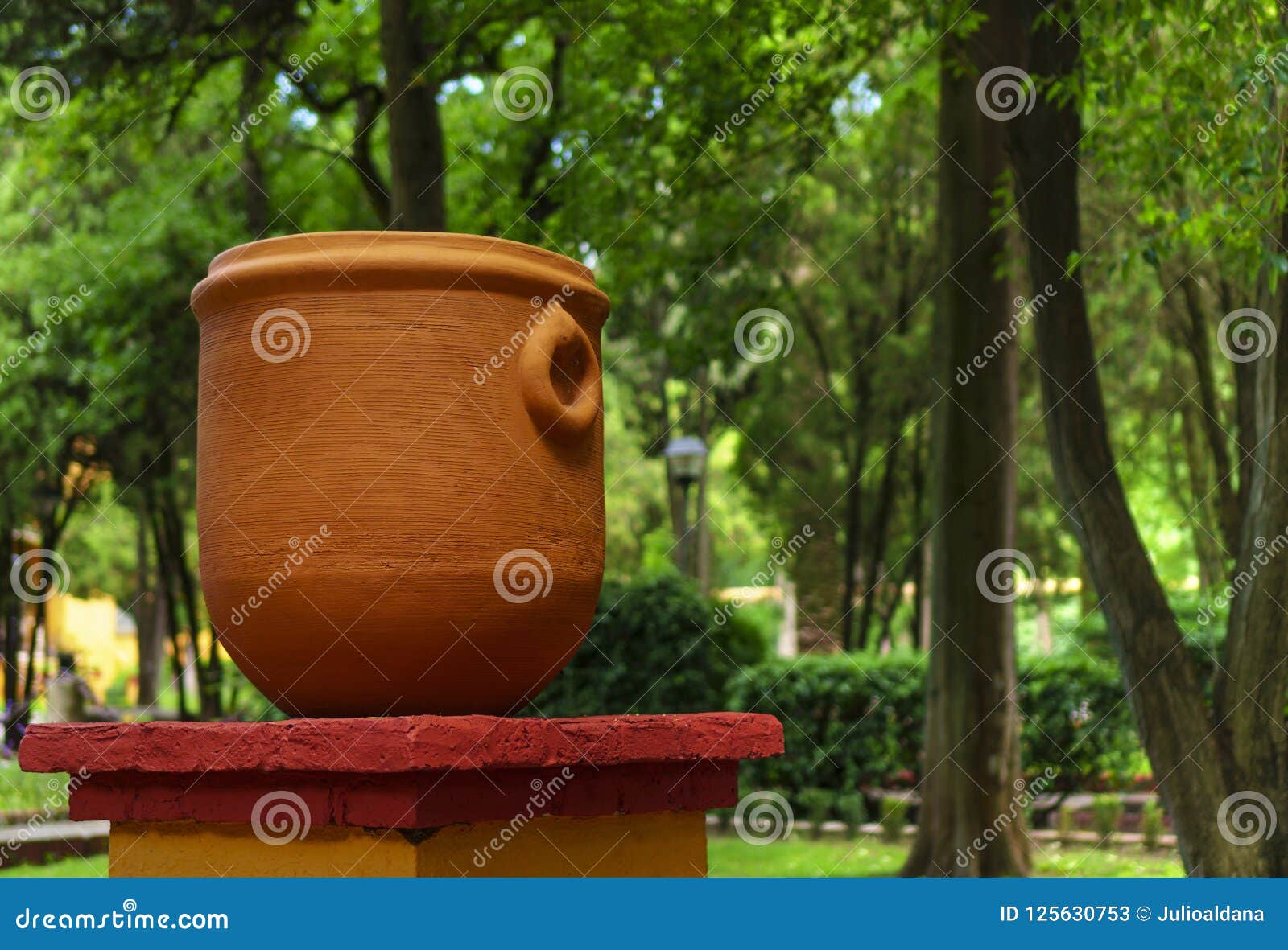 big clay pitcher pot and mexican garden