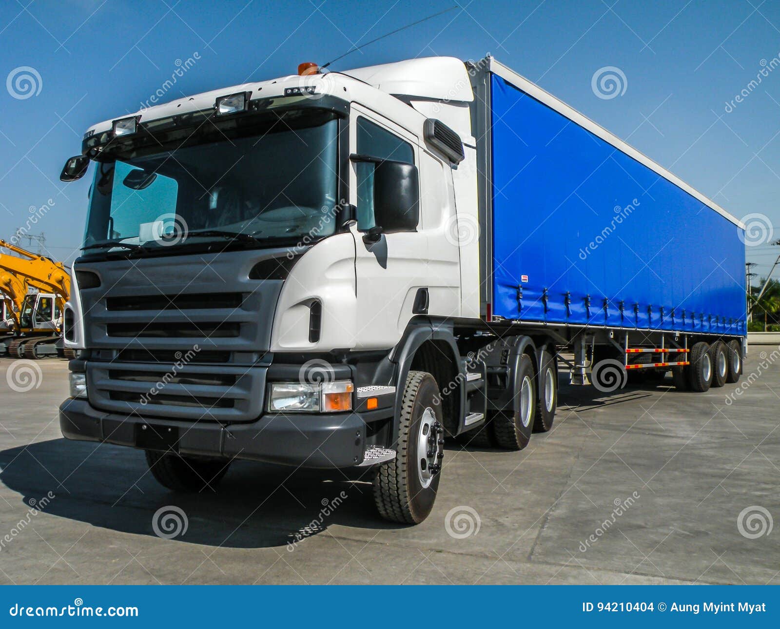 Photo of Big Tractor, with Container Trailer, To Deliver Goods and Products Editorial Stock