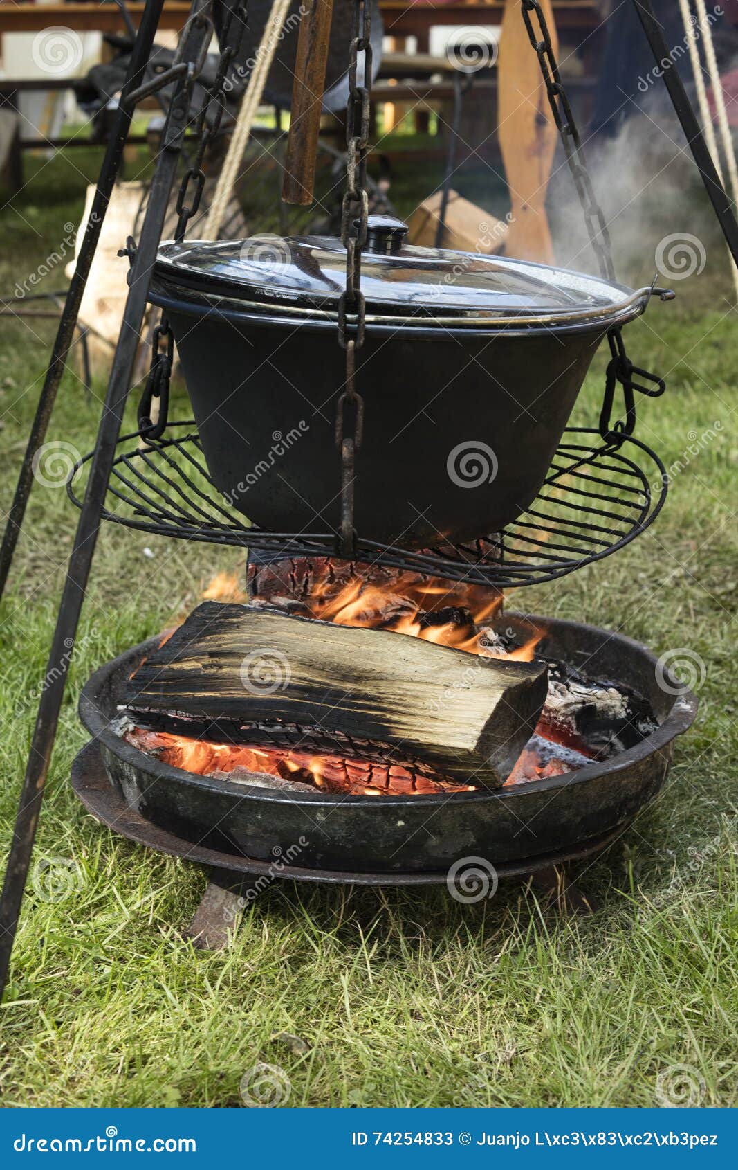 Big Cooking Pot Placed on Fire in a Camping Outdoors Stock Image