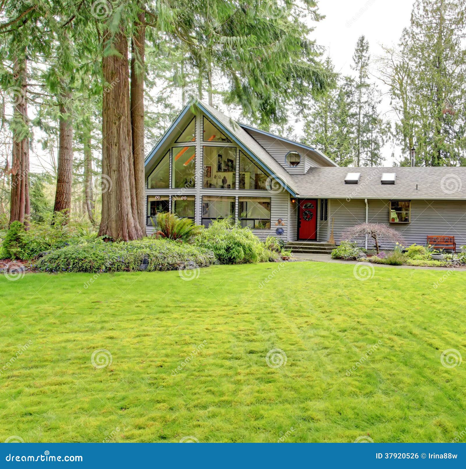 big countryside house beautiful curb appeal tile roof glass wall porch garage green lawn together fir trees 37920526