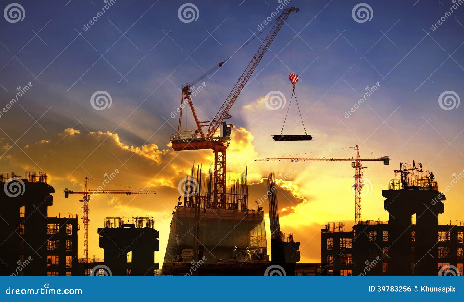 big crane and building construction against beautiful dusky sky