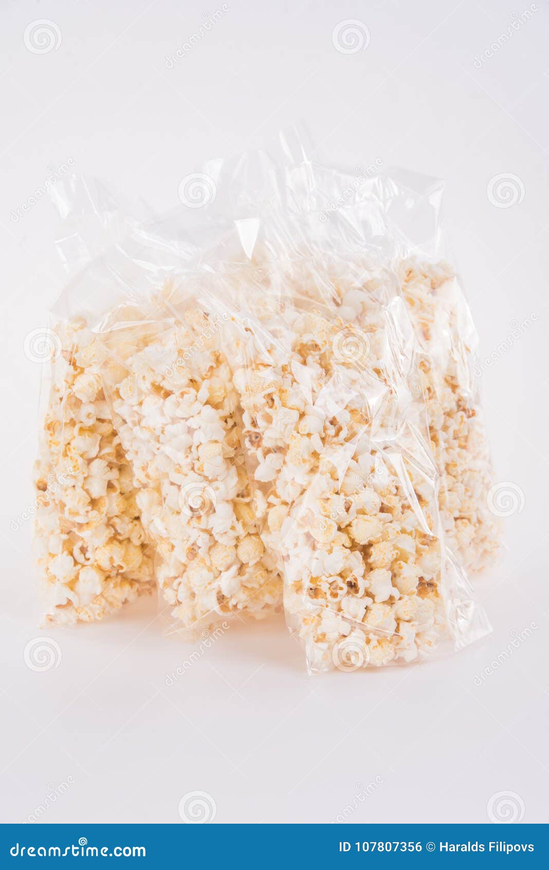 Big and Crispy Natural Popcorn in Transparent Plastic Pack Stock Photo