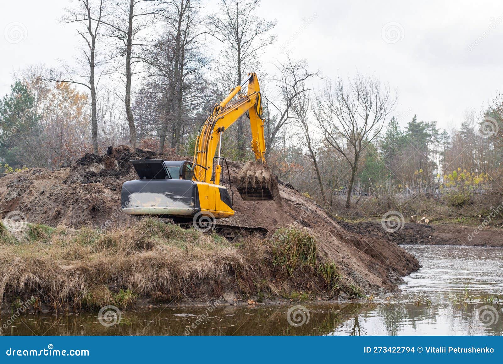 Excavator during digging stock photo. Image of drainage 273422794