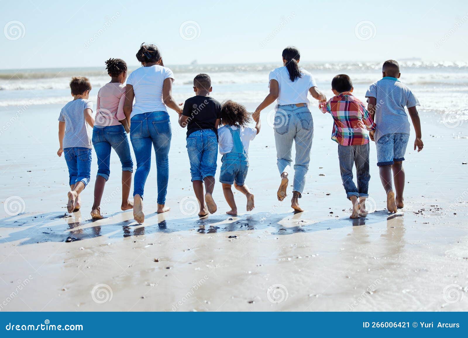 Big Family, Beach Walk and Water for Vacation, Sunshine and Bonding with Interracial Diversity by Waves picture