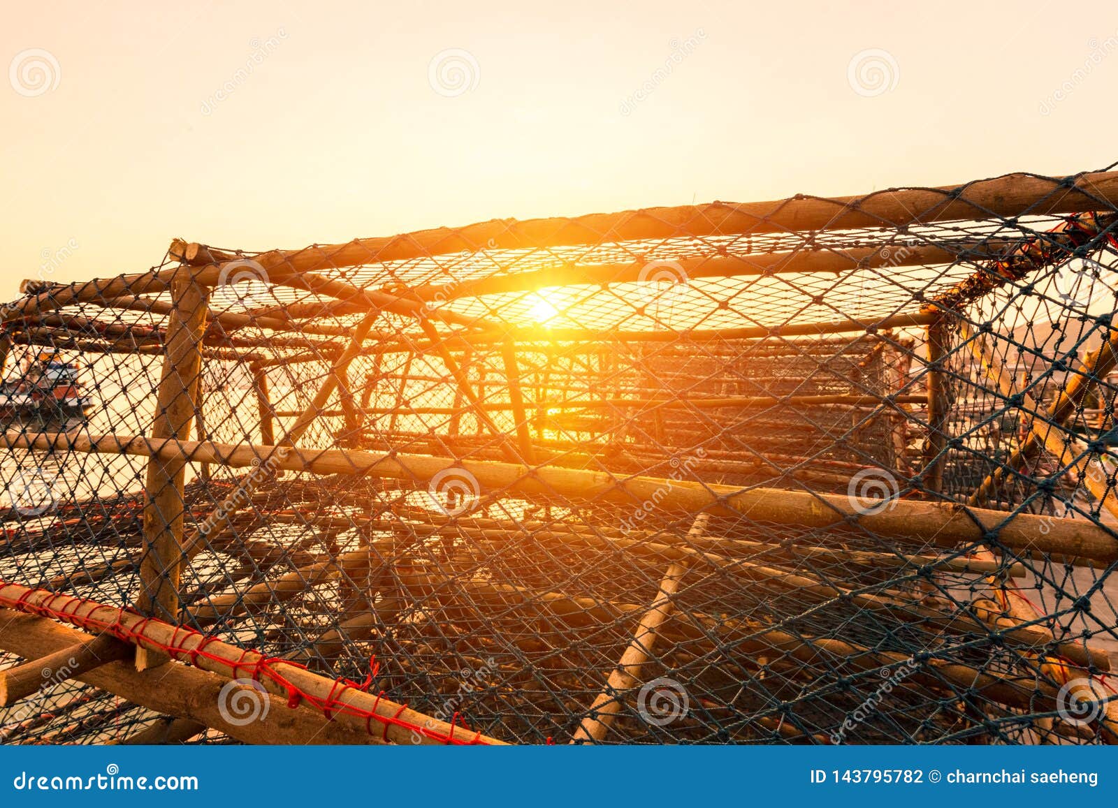 The Big Fish Trap on the Quay Near the Sea with Sunset Stock Photo
