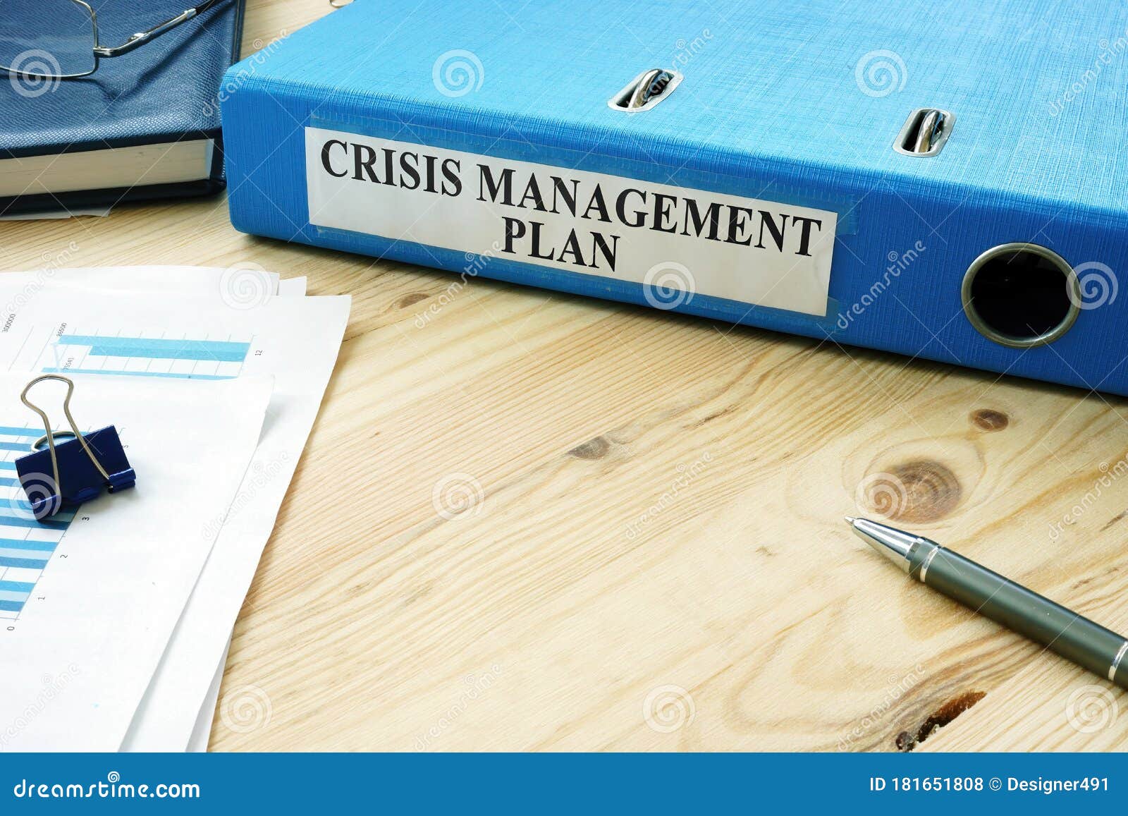 big folder with label crisis management plan.