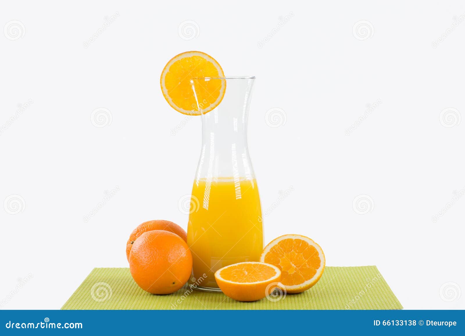Glass Full Of Orange Juice, Carafe With Fresh Juice, Straw And Fresh  Oranges In The Background On Wooden Table Stock Photo, Picture and Royalty  Free Image. Image 105485816.