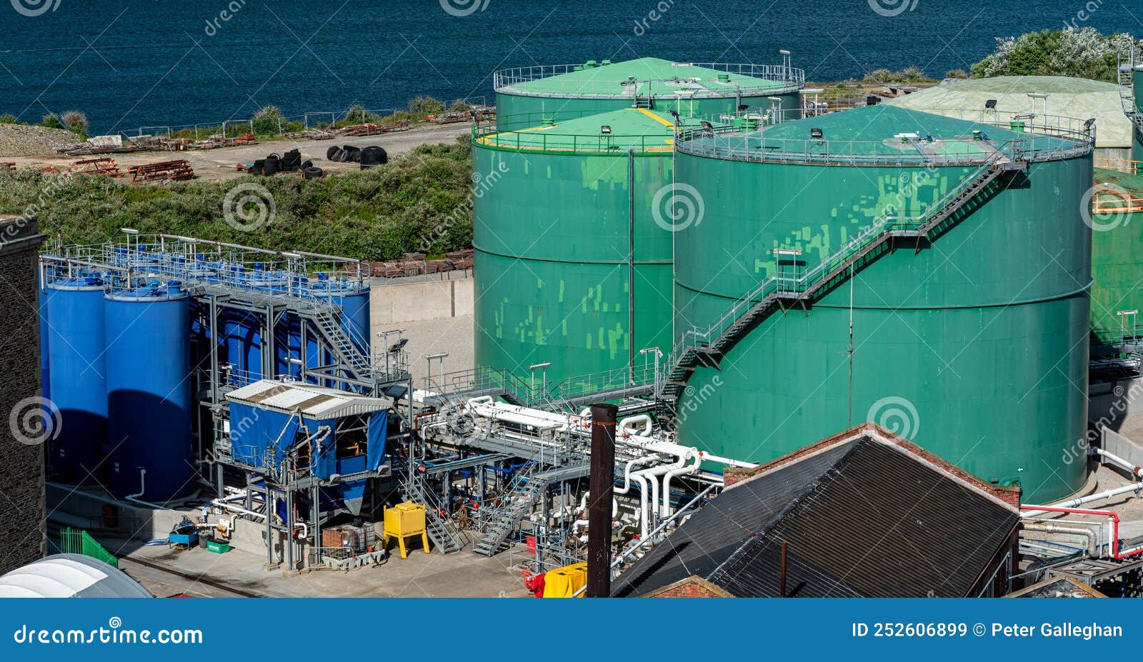 Big Green Fuel Tanks at a Harbor in the Uk Stock Image Image of