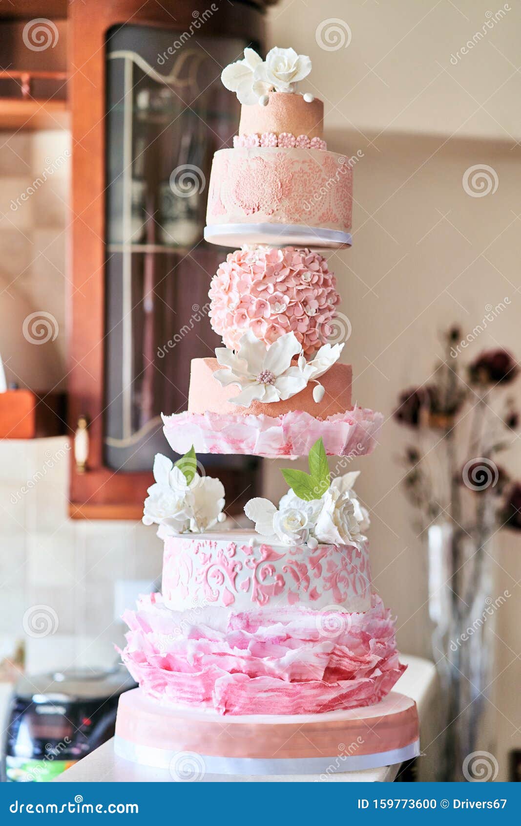 Big Layered Cake Show. Pink Cake with White Roses Stock Photo ...