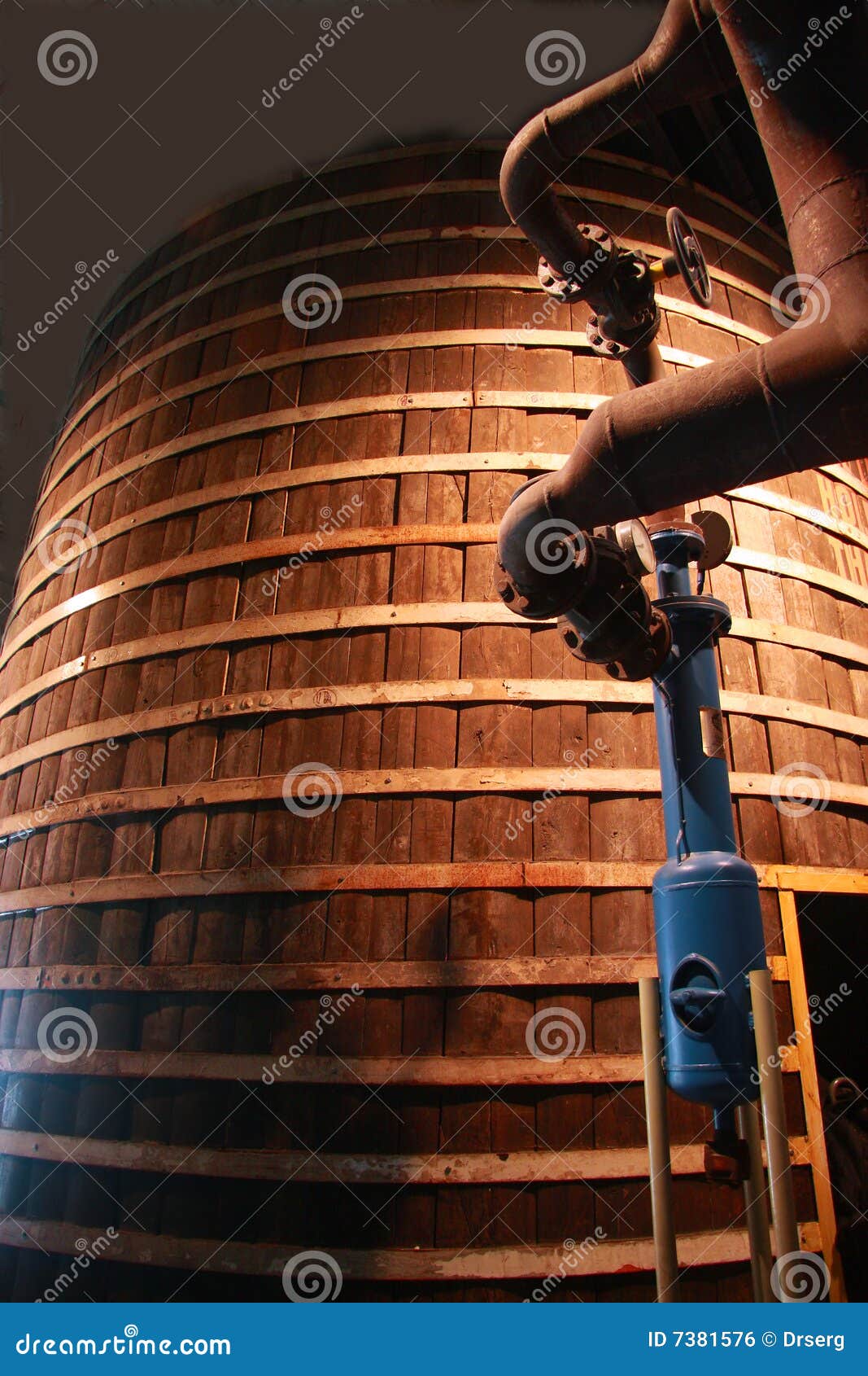 big old wooden tun and metal pipework